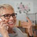 Smiling old woman talking on phone